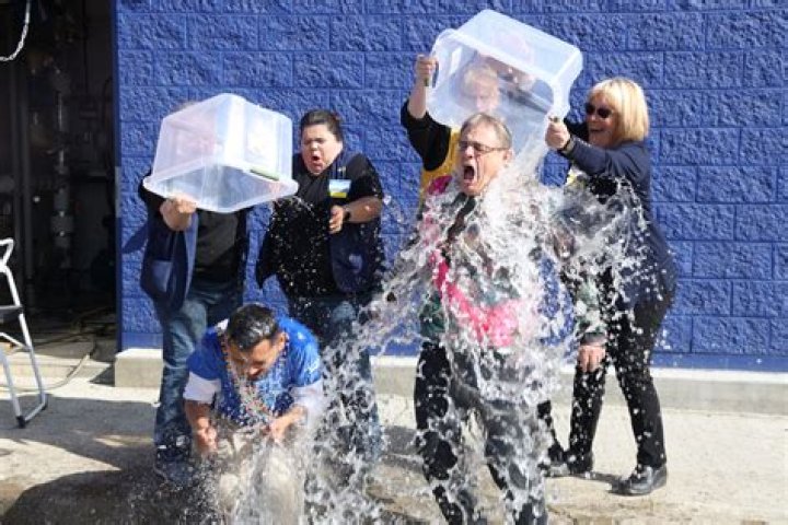 Christian Pache getting water dumped on him in celebration