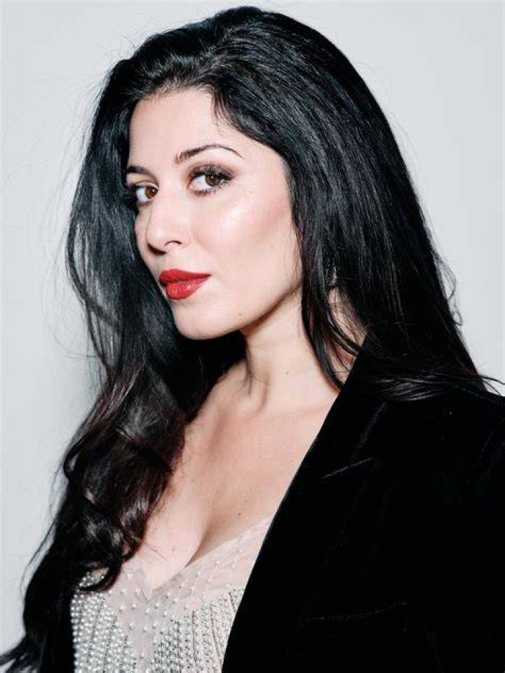 Elizabeth Tabish posing for a photoshoot for her Instagram feed.