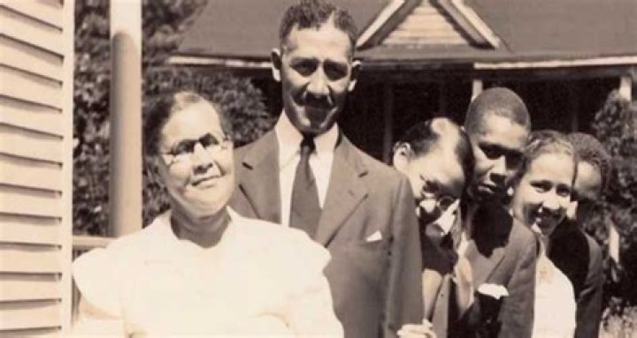 James Francis Goble's wife Katherine Johnson receiving the presidential medal of freedom from former U.S. president Barack Obama.