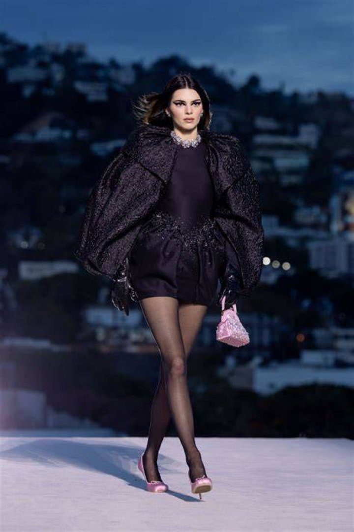 Kendall Jenner walking the runway at a fashion show.