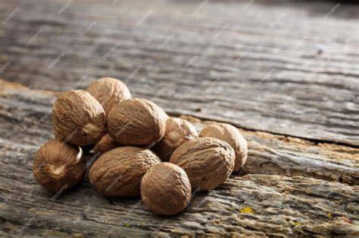 Nutmeg on a wooden surface